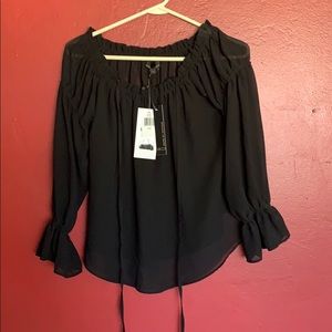 Black off shoulder top.